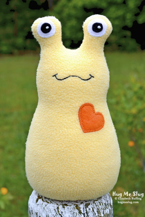 Hug Me Slug handmade stuffed animal banana slug by artist Elizabeth Ruffing