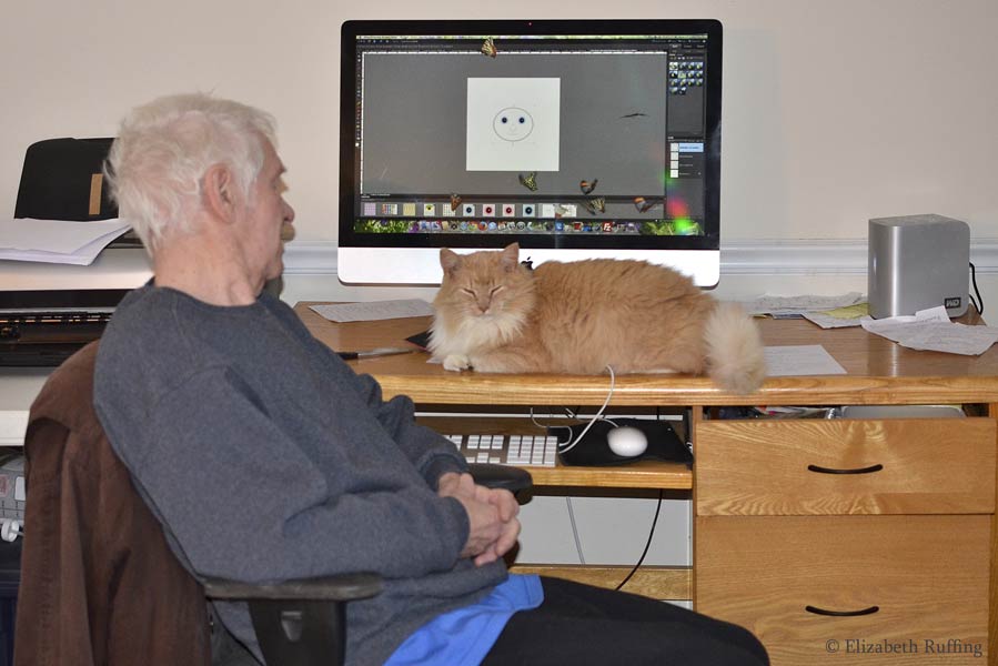 Santana and Dad sitting in front of the computer, by Elizabeth Ruffing