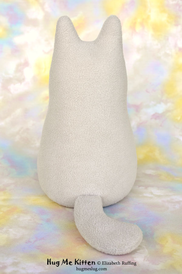 Hug Me Kitten plush art toy, oatmeal with a lavender heart, by Elizabeth Ruffing