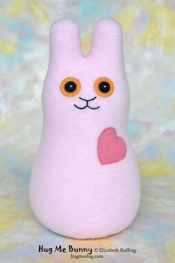 Hug Me Bunny plush art toy, pink fleece plushie, by Elizabeth Ruffing