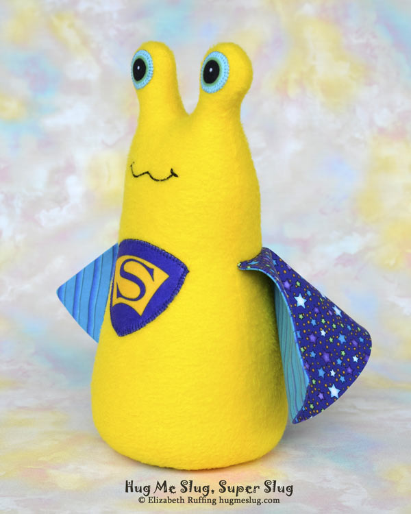 Super Slug plush art toy, yellow and purple-blue, by Elizabeth Ruffing