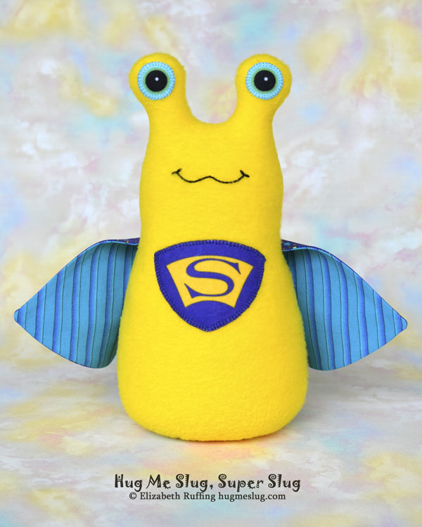 Super Slug plush art toy, yellow and purple-blue, by Elizabeth Ruffing