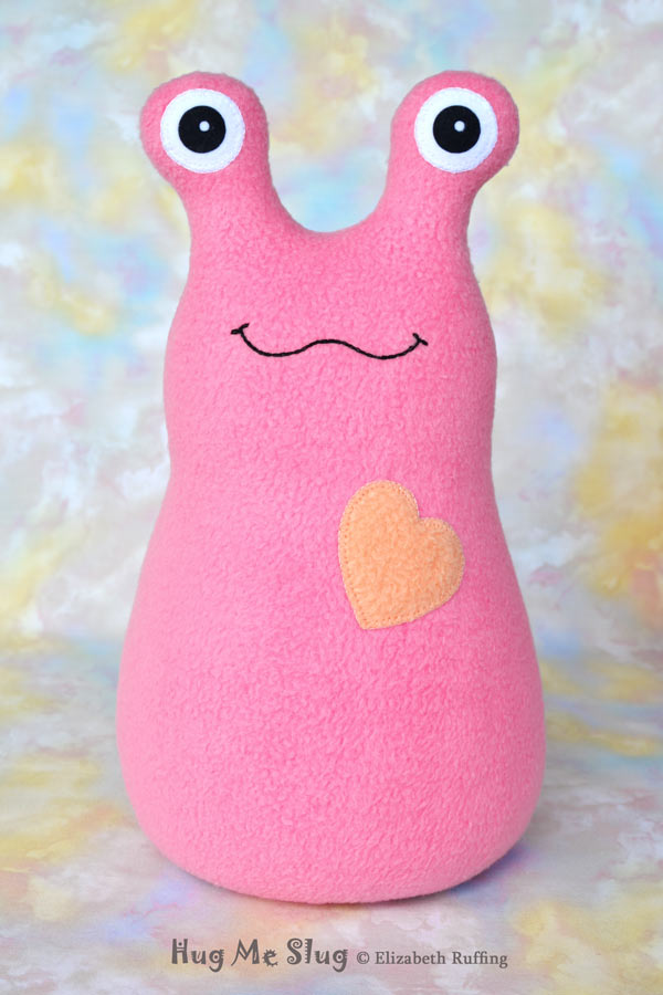 12 inch Handmade Medium Pink Hug Me Slug Stuffed Animal Plush Art Toy with Periwinkle Blue Heart by artist Elizabeth Ruffing