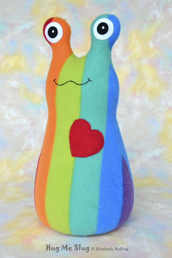 Rainbow striped Hug Me Slug, handmade stuffed animal plush toy by Elizabeth Ruffing, 12 inch