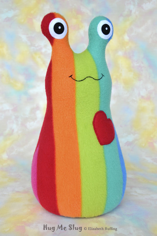Rainbow striped Hug Me Slug, handmade stuffed animal plush toy by Elizabeth Ruffing, 12 inch