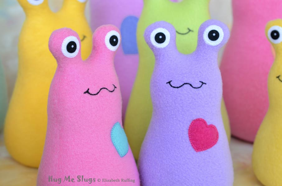 Assorted Handmade Fleece Hug Me Slug Stuffed Animal Plush Art Toys by artist Elizabeth Ruffing