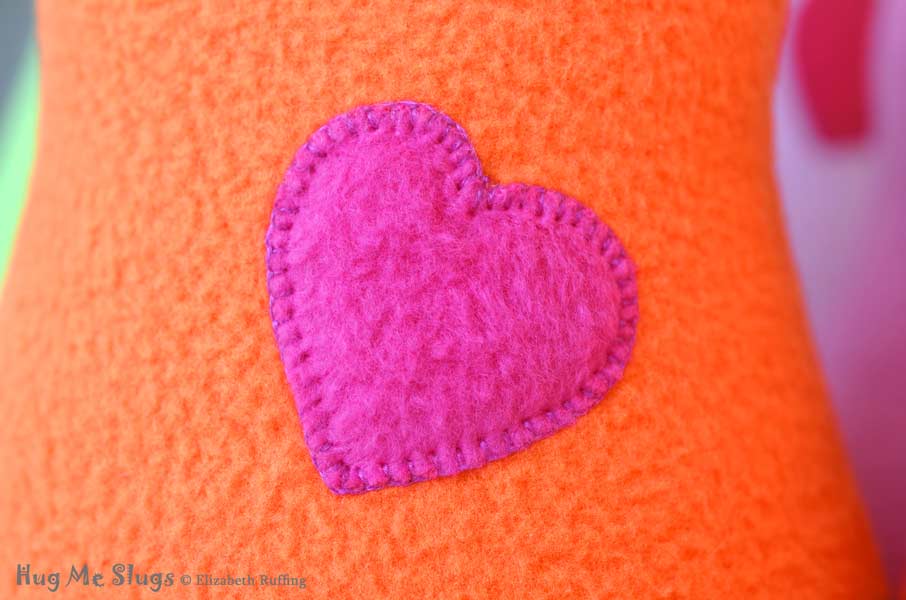 Chain Stitched Heart on Handmade Fleece Hug Me Slug Stuffed Animal Plush Art Toy by artist Elizabeth Ruffing