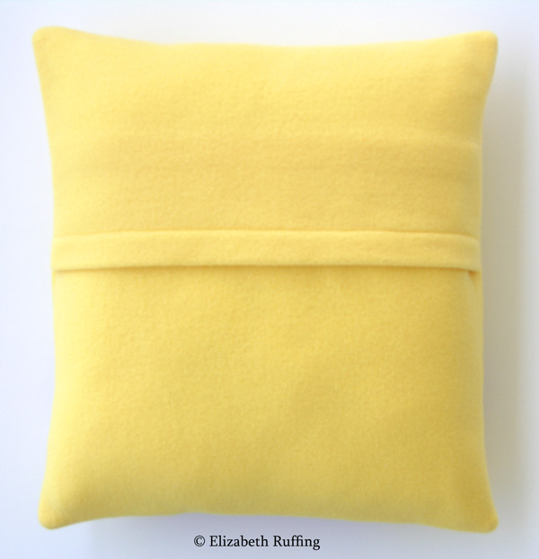 Yellow fleece decorative throw pillow back with envelope closure by Elizabeth Ruffing