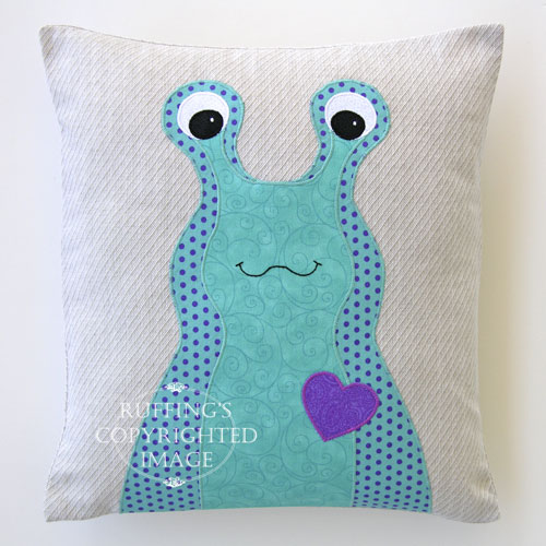 Turquoise, Purple, and Oatmeal Hug Me Slug Decorative Pillow by Elizabeth Ruffing