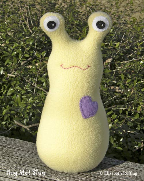 Light yellow fleece Hug Me Slug by Elizabeth Ruffing
