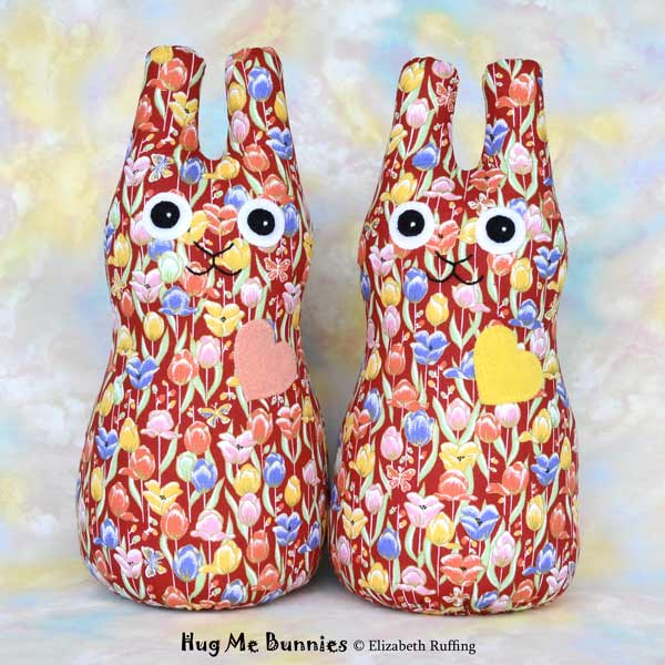 Red, orange, yellow, blue tulip print Hug Me Bunny rabbit art toys by Elizabeth Ruffing