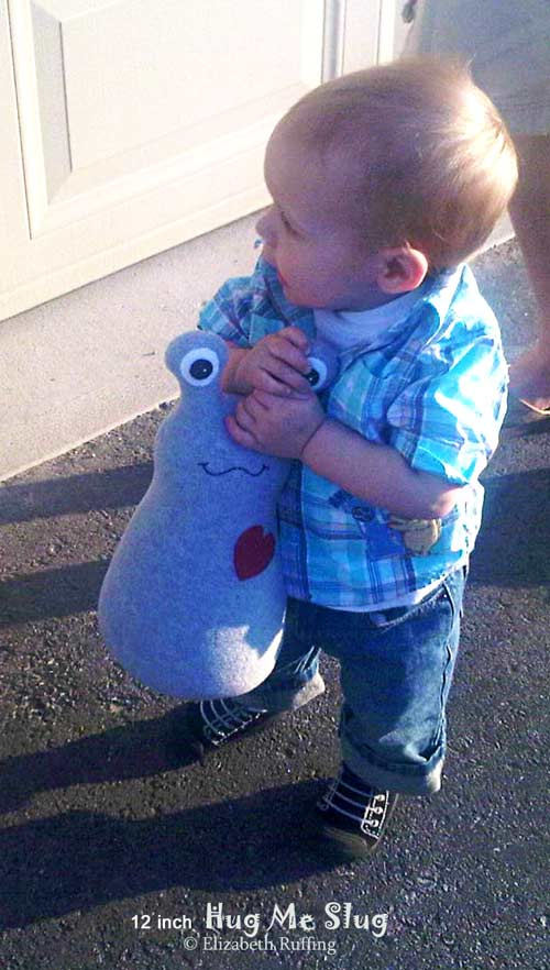 Hug Me Slug with Toddler, handmade art toy by Elizabeth Ruffing