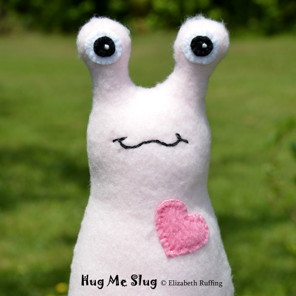 Light pink Hug Me Slug, original art toys by Elizabeth Ruffing