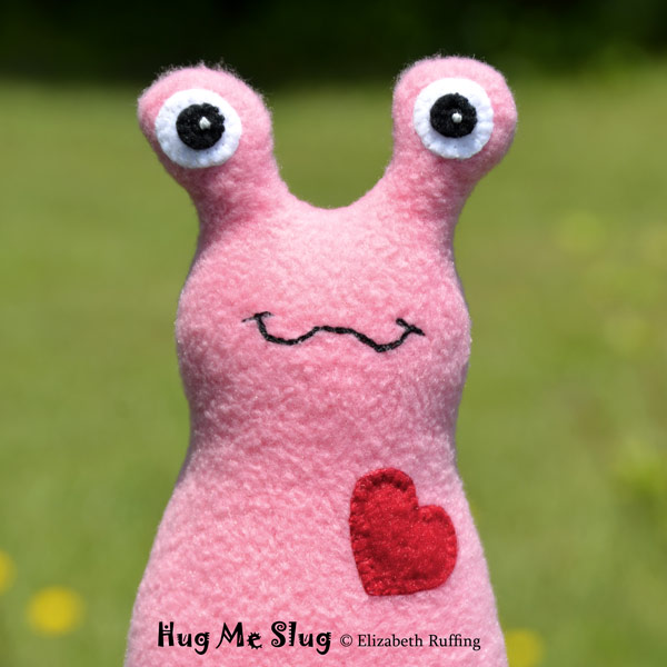 Medium pink Hug Me Slug, original art toys by Elizabeth Ruffing