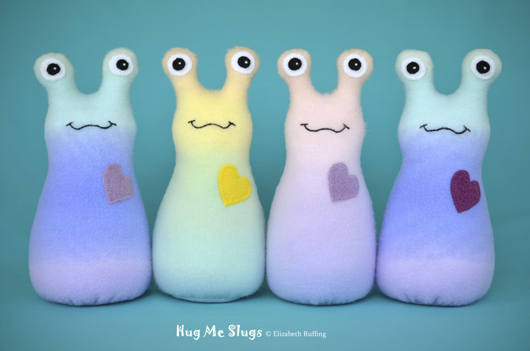 Rainbow Hug Me Slugs, original art toys by Elizabeth Ruffing
