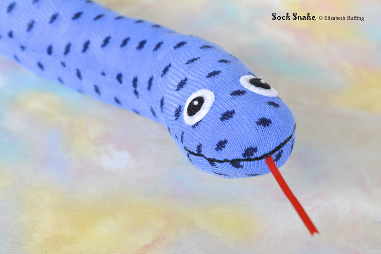 Blue polka dotted sock snake, original art toy by Elizabeth Ruffing