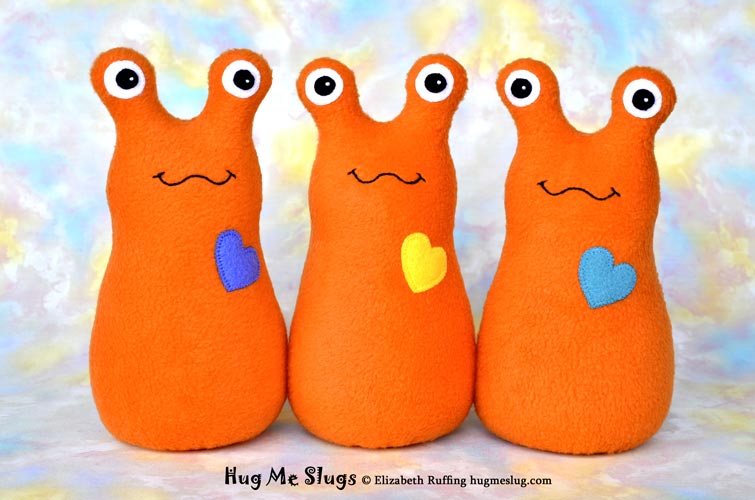 Slugterra and orange fleece Hug Me Slugs, original stuffed animal art toy by Elizabeth Ruffing