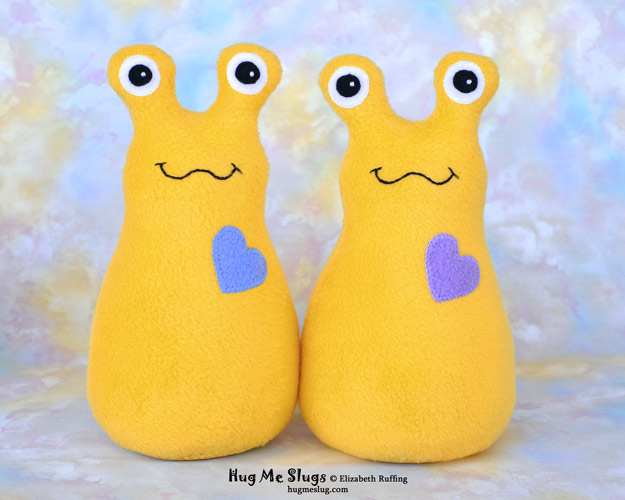 Daffodil yellow Hug Me Slugs handmade stuffed animal banana slug art toys by artist Elizabeth Ruffing