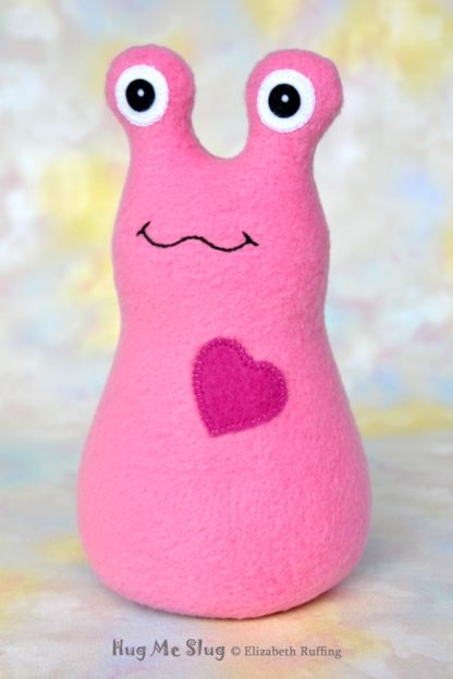 Handmade Medium Pink Fleece Hug Me slug plush toy, royal blue heart, 7 inches, by artist Elizabeth Ruffing