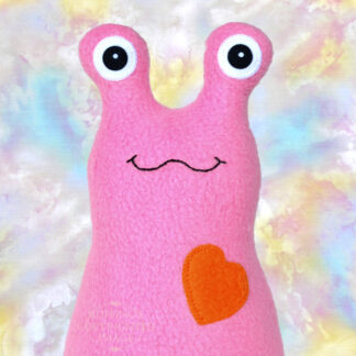 Handmade fleece Hug Me Slug plush toy, medium pink, orange heart by artist Elizabeth Ruffing