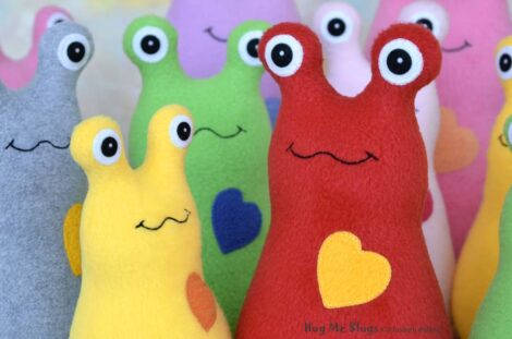 Assorted fleece Hug Me Slug plush toys by artist Elizabeth Ruffing