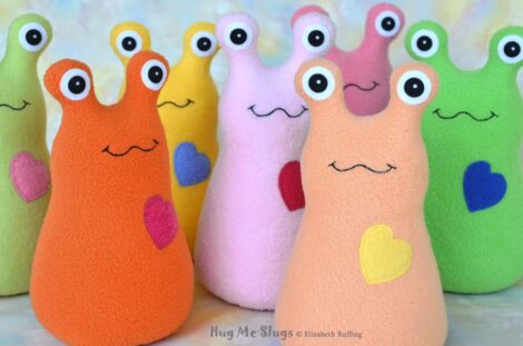 Assorted fleece Hug Me Slug plush toys by artist Elizabeth Ruffing