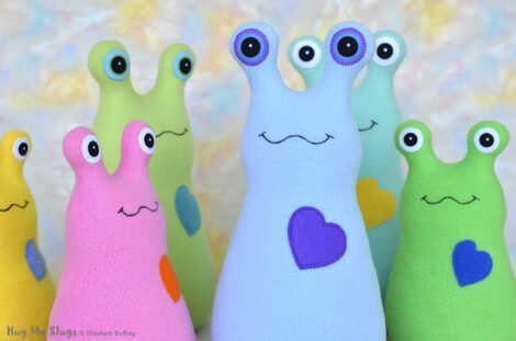 Assorted fleece Hug Me Slug plush toys by artist Elizabeth Ruffing