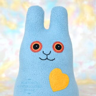 Smiling light gray-blue fleece bunny with a daffodil yellow heart