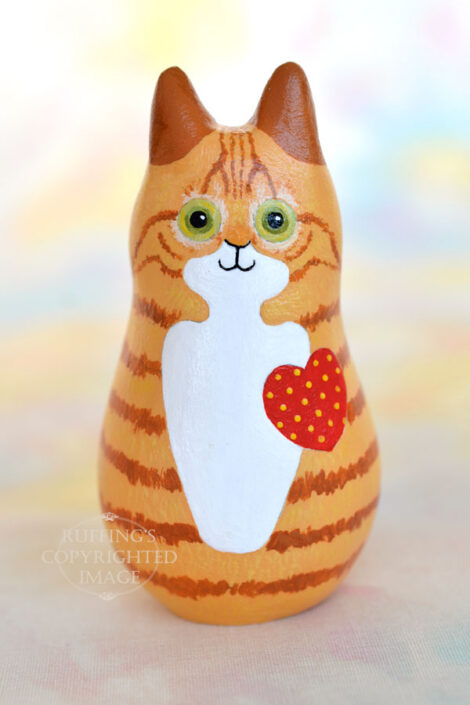 Ginger-and white-tabby cat figurine front view